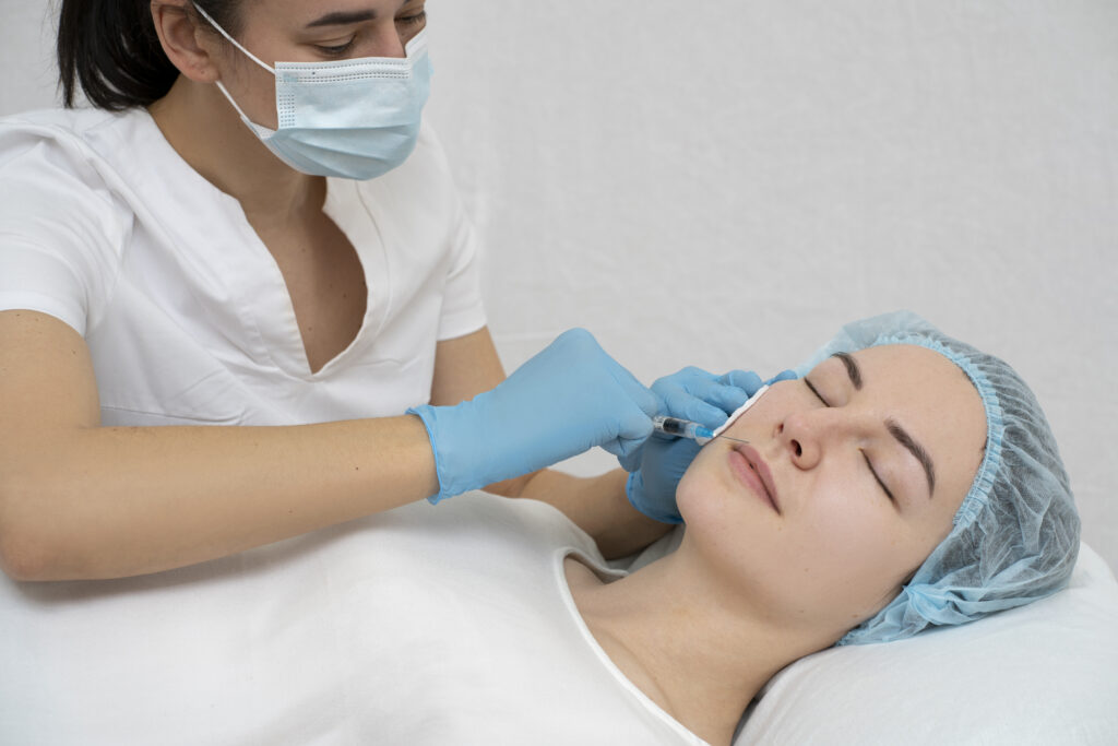close up woman lip filler procedure